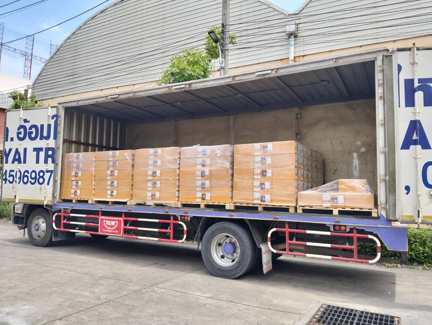 Truck loaded with organized palletized boxes - systematic cargo transport